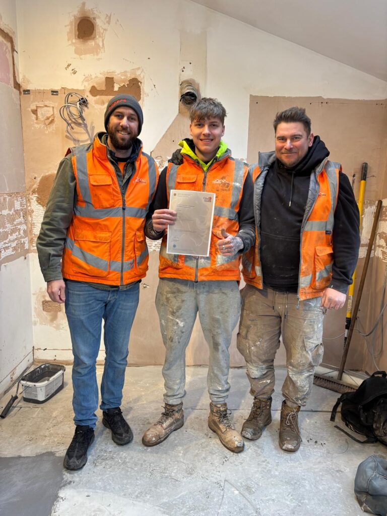 Sean Parker and Paul Grears of Parker Grears Developments with their newly qualified apprentice bricklayer