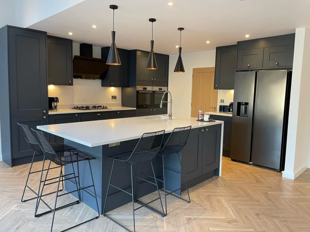 Dark kitchen extension with island by Parker Grears