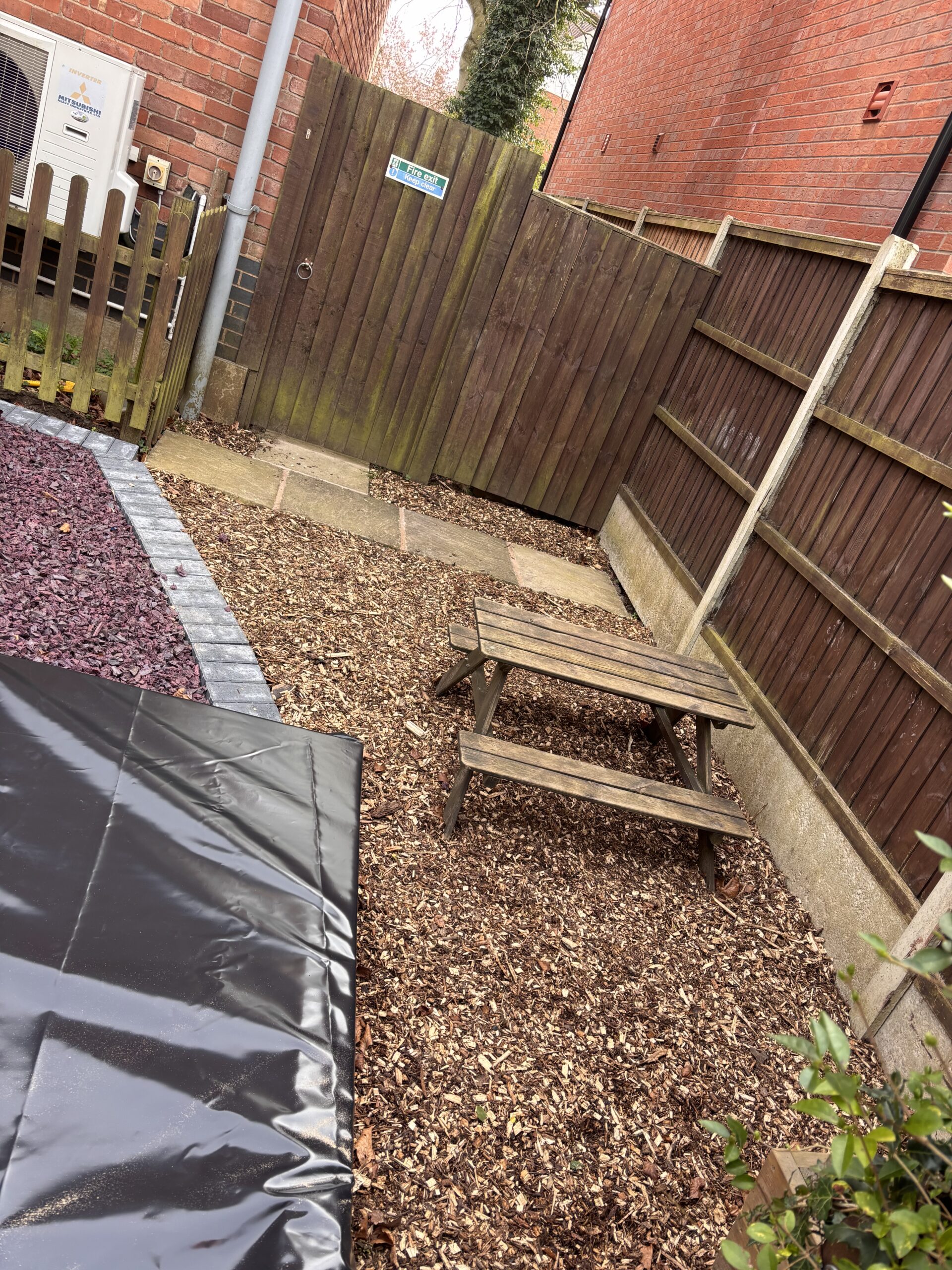 New bark play and seating area by sandpit