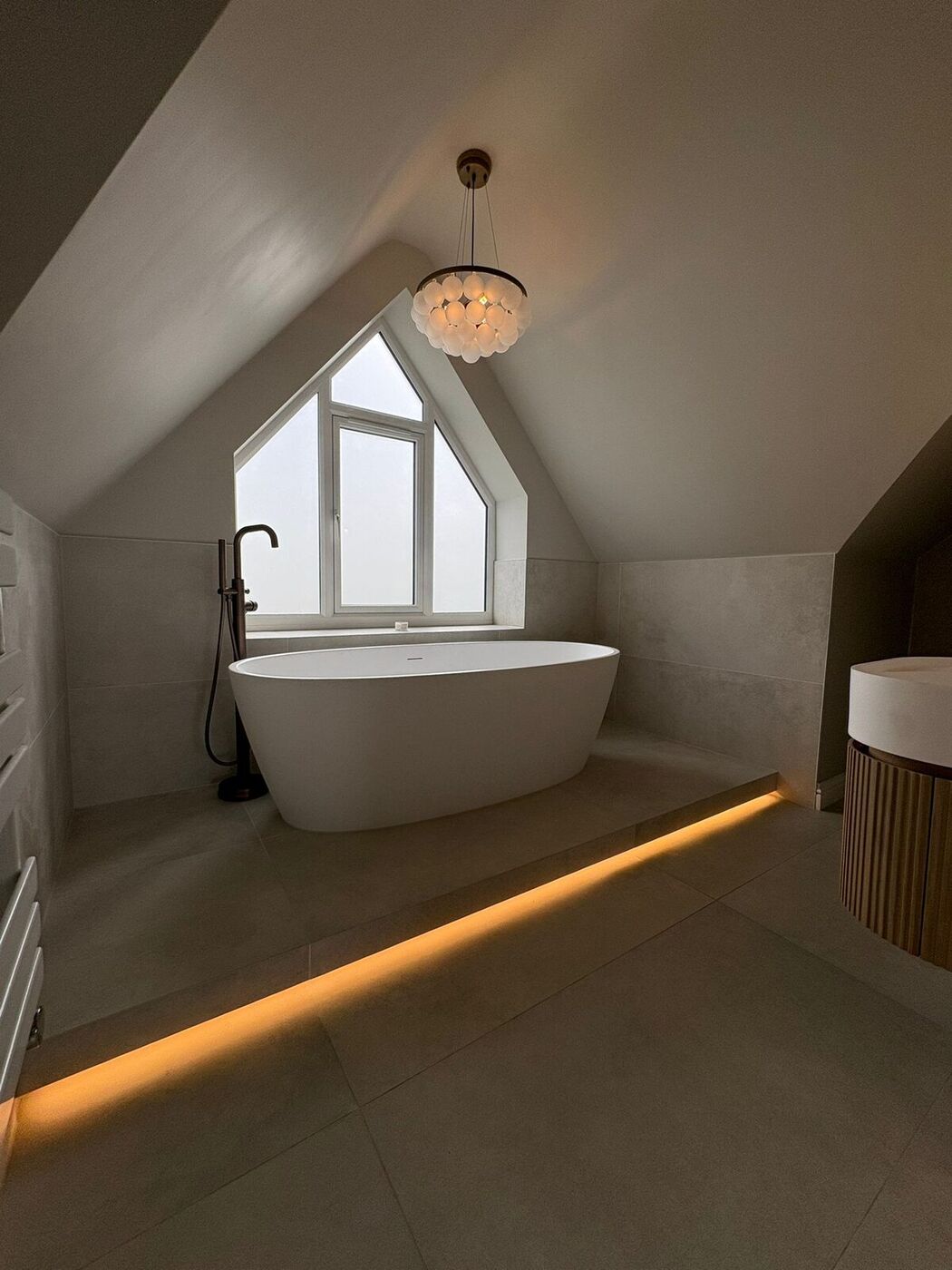 Freestanding bath in the master en-suite, apex window in a vaulted ceiling