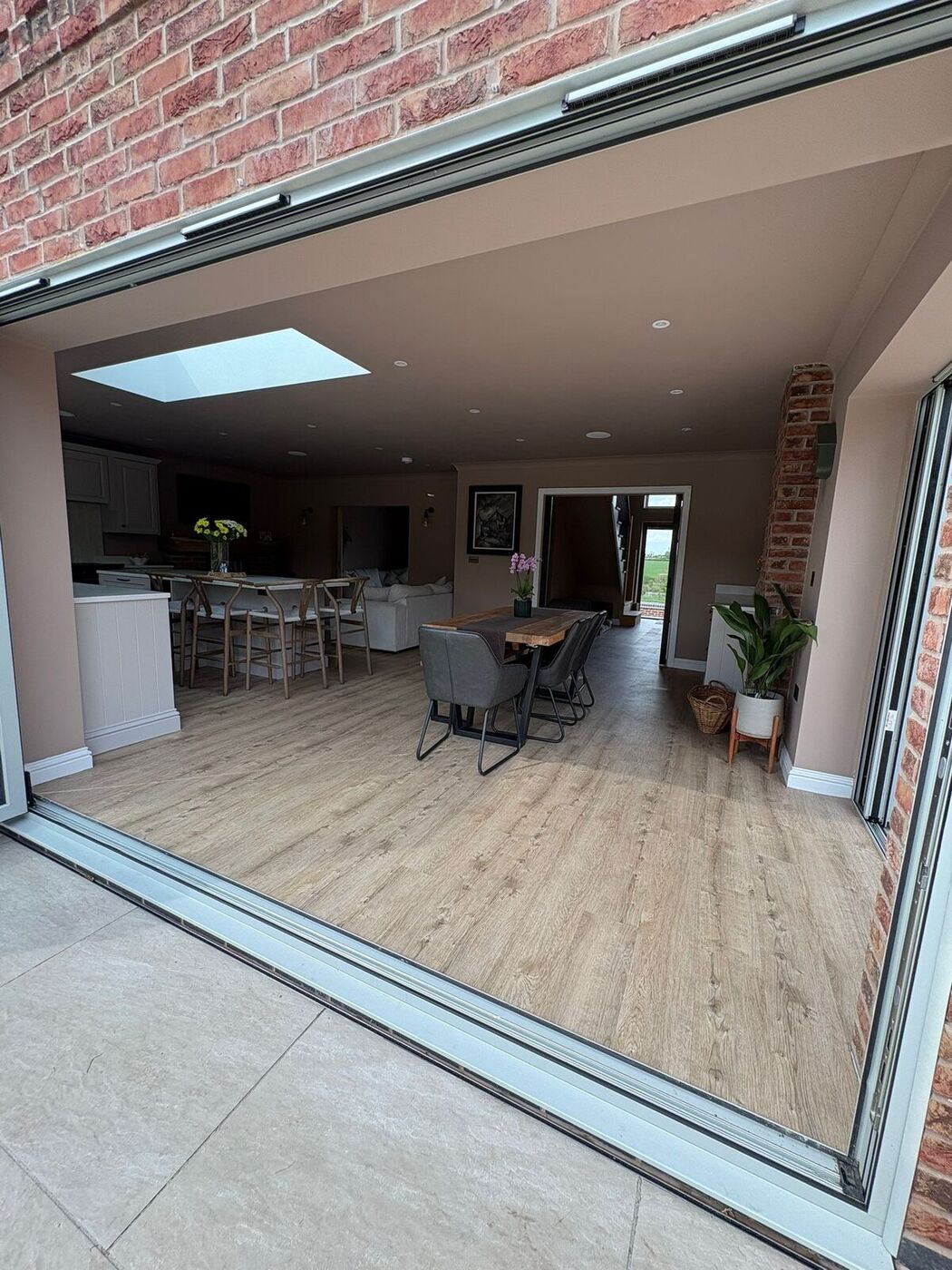 Rear extension kitchen with bifold doors open to the garden, Wolvey