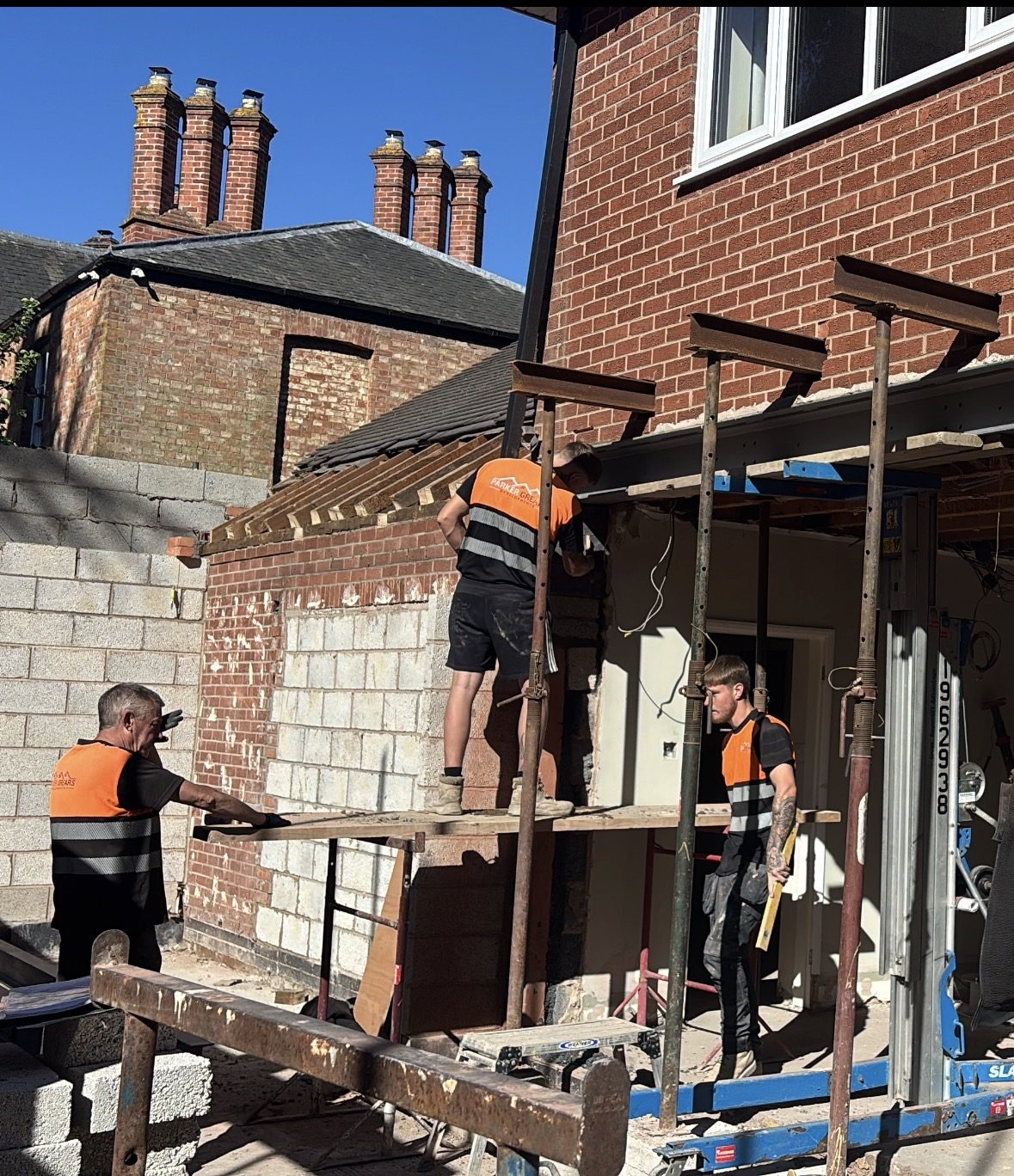 Parker Grears team working on the gable of a double storey extension in Leicestershire