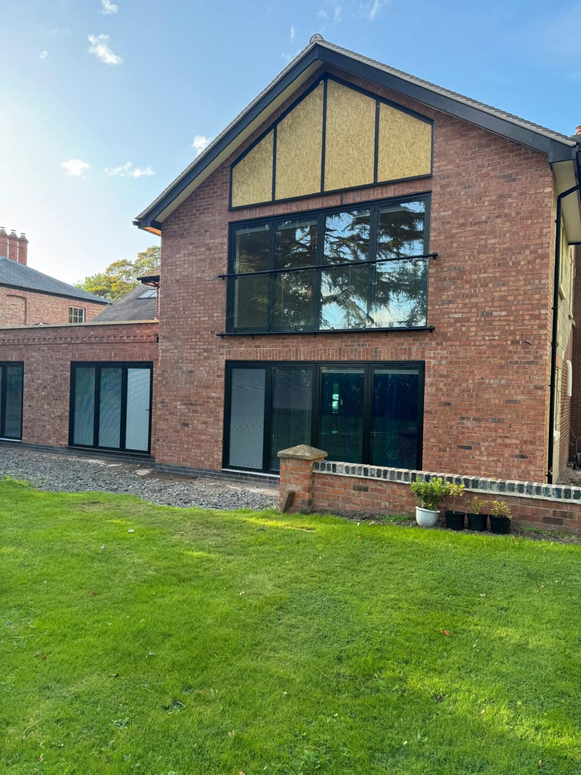 Gable of the double storey rear extension in Leicestershire with full height glazing