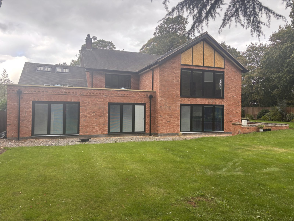 Double storey rear extension in Leicestershire with full height gable glazing and bifold doors, built by Parker Grears Developments